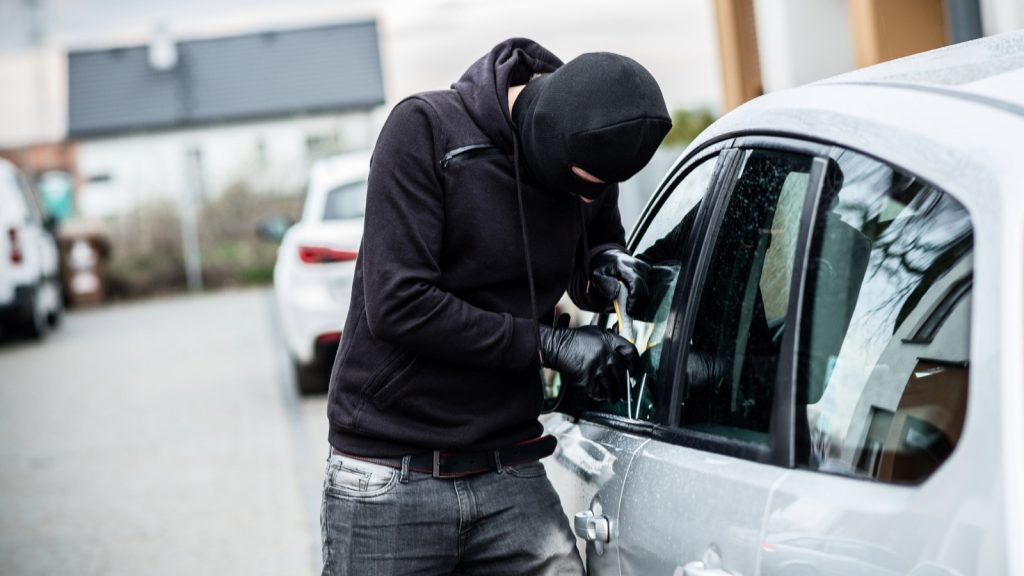 Thief Breaking into Car